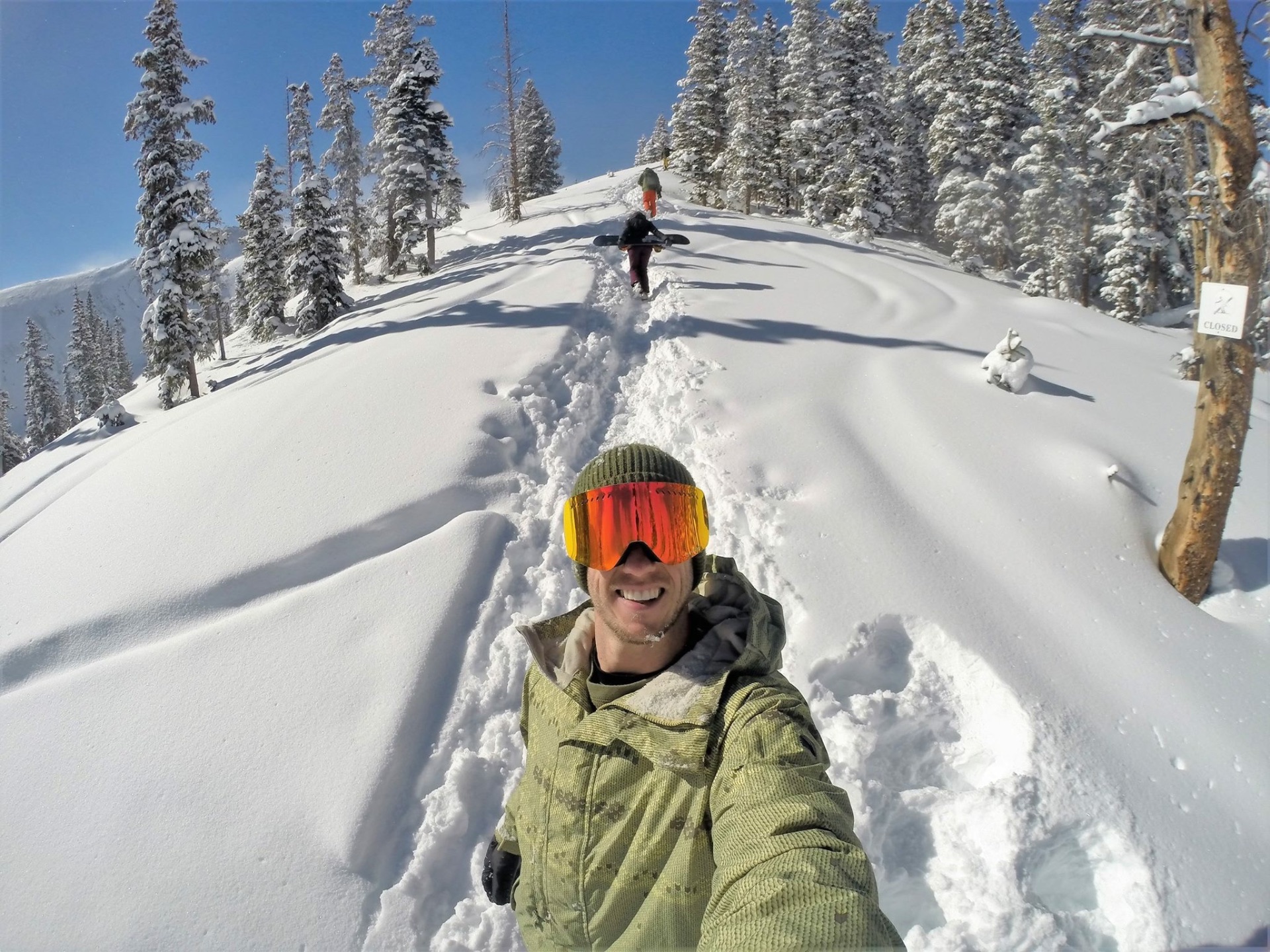 Sean snowboarding in fresh powder